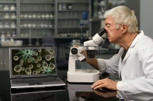 9501817-biologist-looking-through-a-microscope-in-a-research-lab